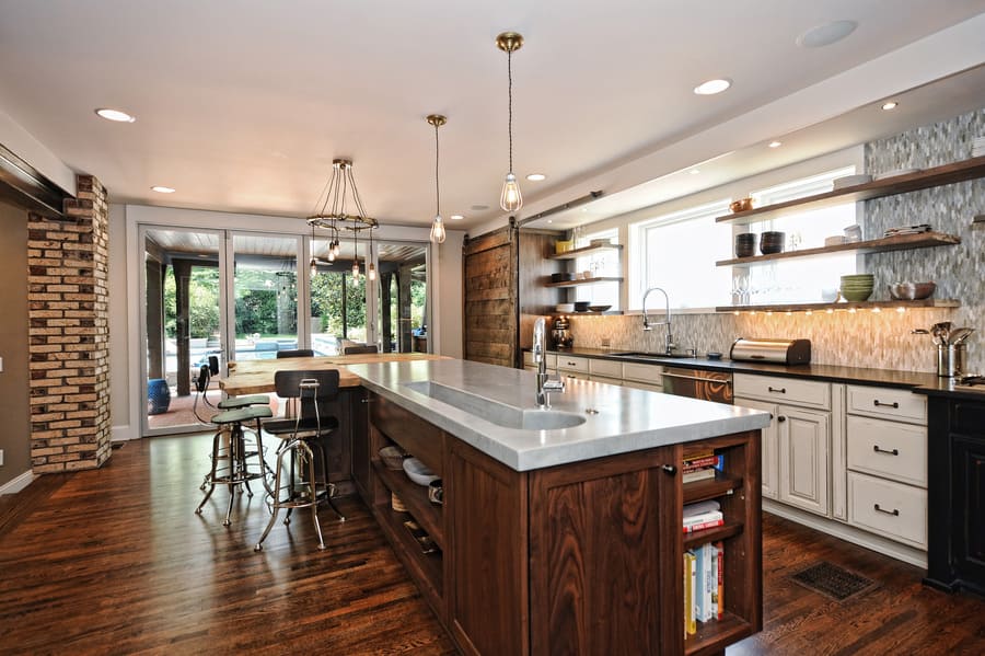 brown wooden rustic kitchen island with white countertop by hopedale builders in charlotte