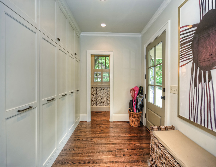 mudroom entrance with hardwood floors and white cabinets by Hopedale Builders in Charlotte, NC