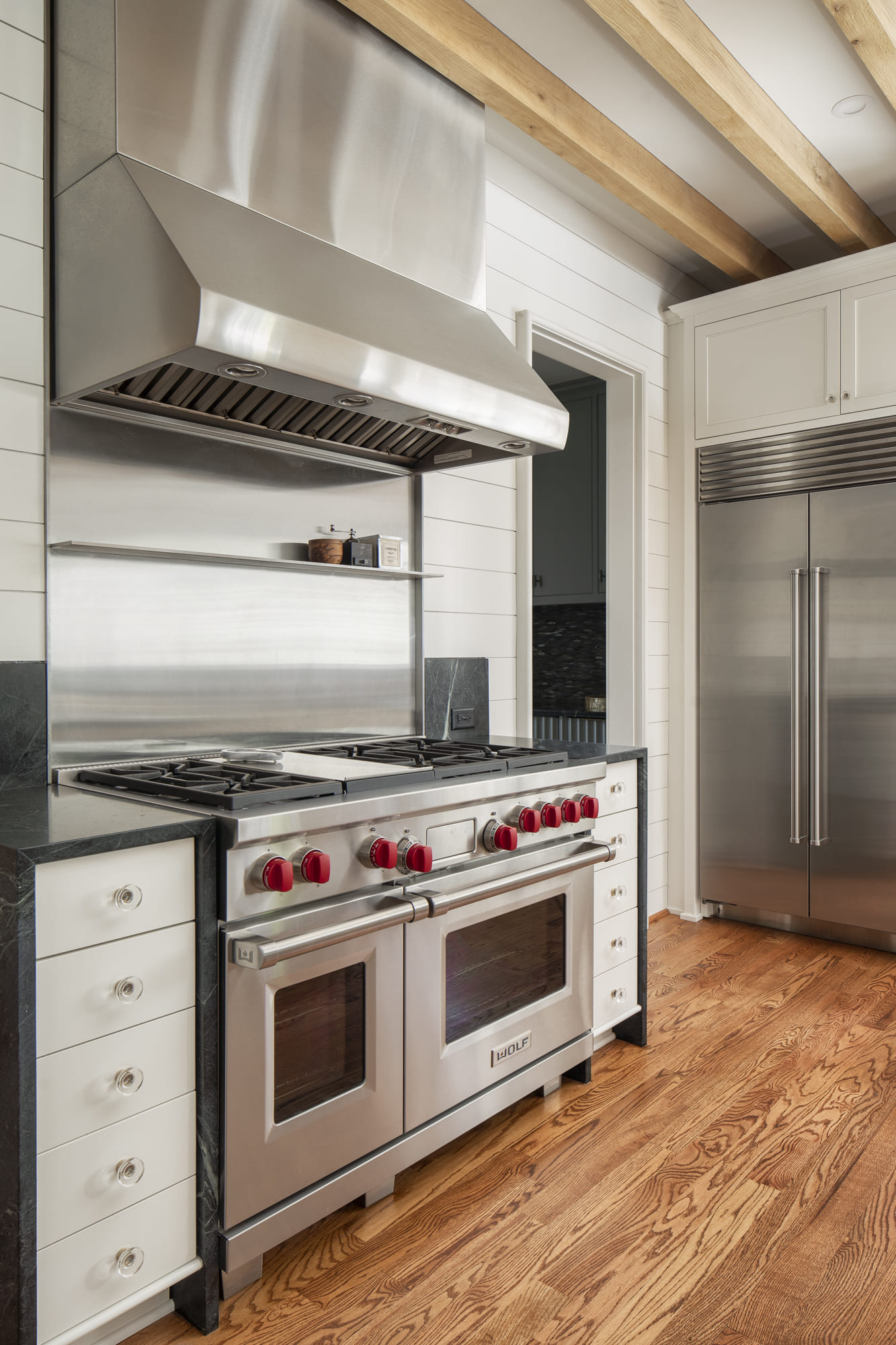 kitchen remodel with hardwood floor and stainless steel appliances in charlotte, nc by Hopedale Builders