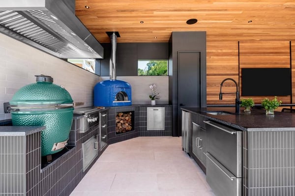 Pool house kitchen in Charlotte, NC with stove, oven, and sink by Hopedale Builders