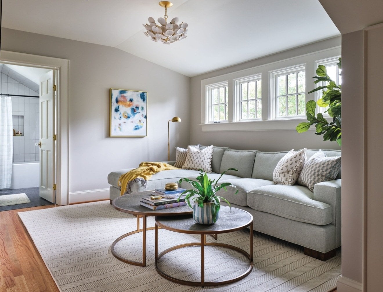 Cozy living space with a neutral color palette, stylish furnishings, and a view of an adjacent bathroom – Addition in Historic Dilworth, NC by Hopedale Builders, Inc. Cozy living space with a neutral color palette, stylish furnishings, and a view of an adjacent bathroom – Addition in Historic Dilworth, NC by Hopedale Builders, Inc.