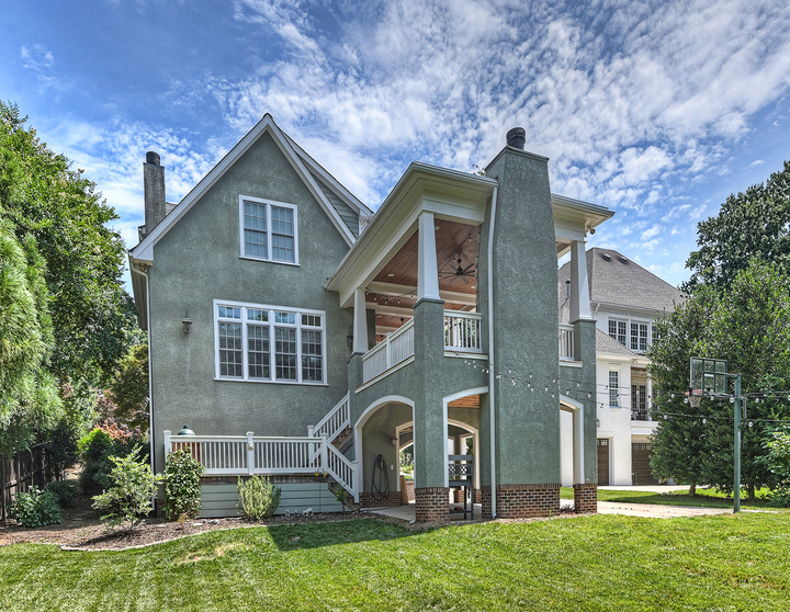 Exterior of remodeled house with multiple levels by Hopedale Builders in Charlotte, NC