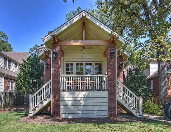 Exterior of remodeled home with two sets of stairs leading to patio door by Hopedale Builders in Charlotte, NC