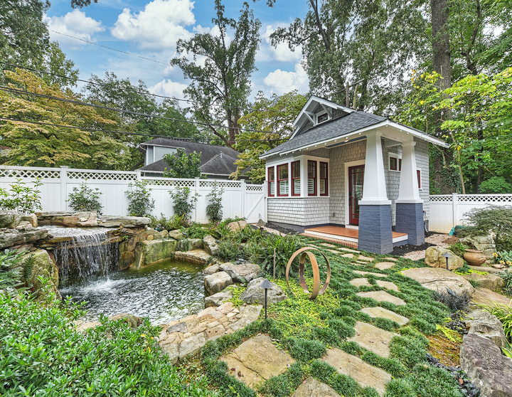 Exterior of remodeled guest house addition with pond in backyard by Hopedale Builders in Charlotte, NC