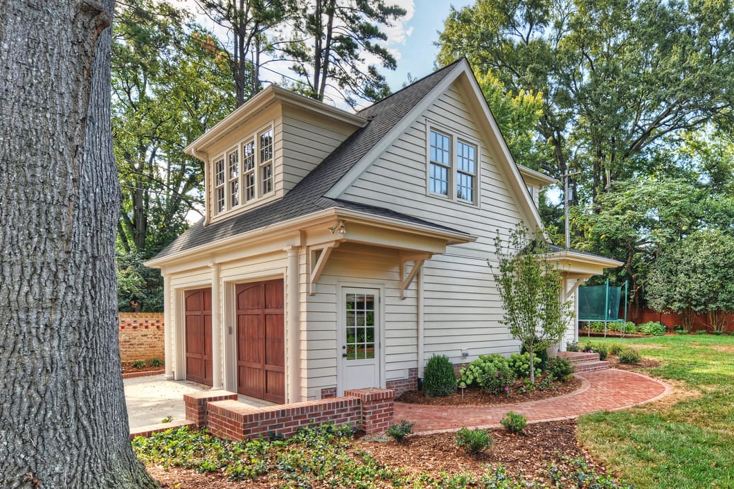 Tan detached garage with second story guest suite by Hopedale builders in charlotte, NC