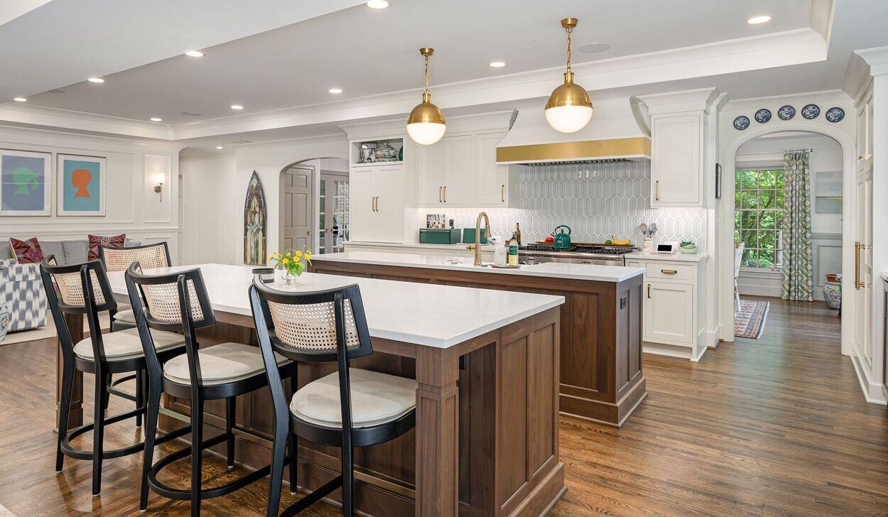 Elegant kitchen featuring white cabinetry, a wooden island, and modern lighting, completed in a whole home remodel in Olde Providence, Charlotte by Hopedale Builders Elegant kitchen featuring white cabinetry, a wooden island, and modern lighting, completed in a whole home remodel in Olde Providence, Charlotte by Hopedale Builders
