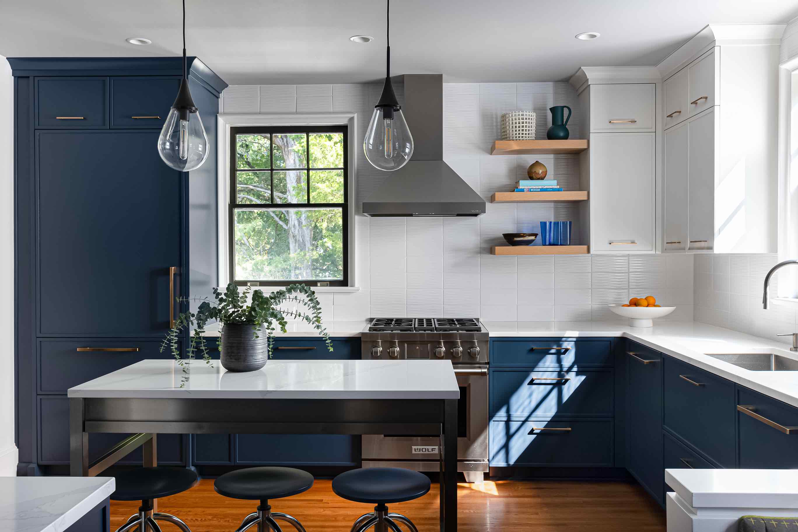 Whit Counterops & Island With Modern Appliances In Kitchen Remodel in Dartmouth Place, NC By Hopedale Builders