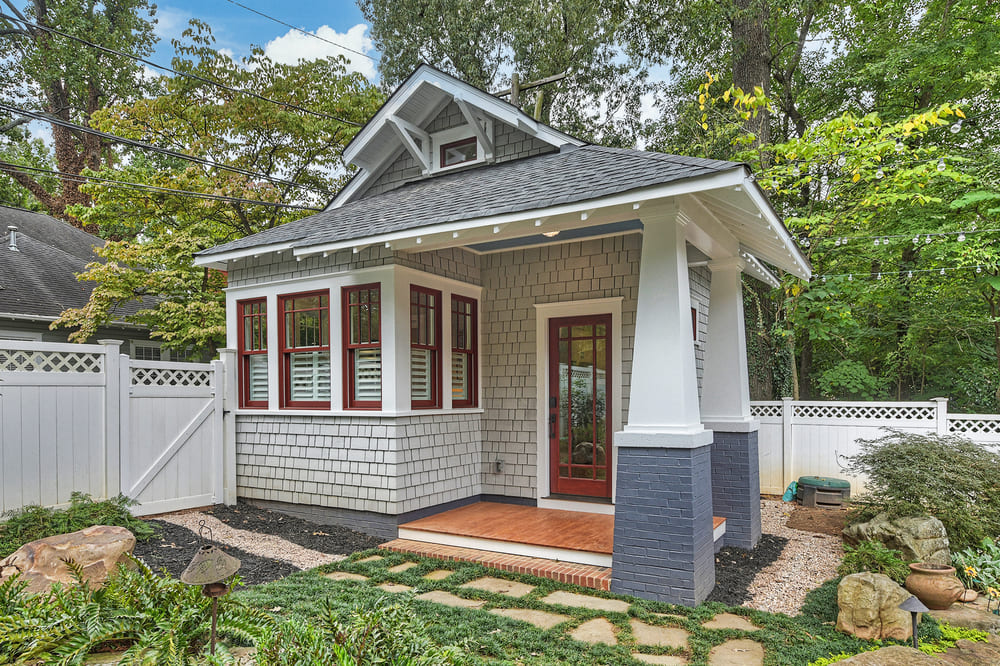 custom home addition guest suite with gray exterior and stone walkway by Hopedale in Charlotte, NC