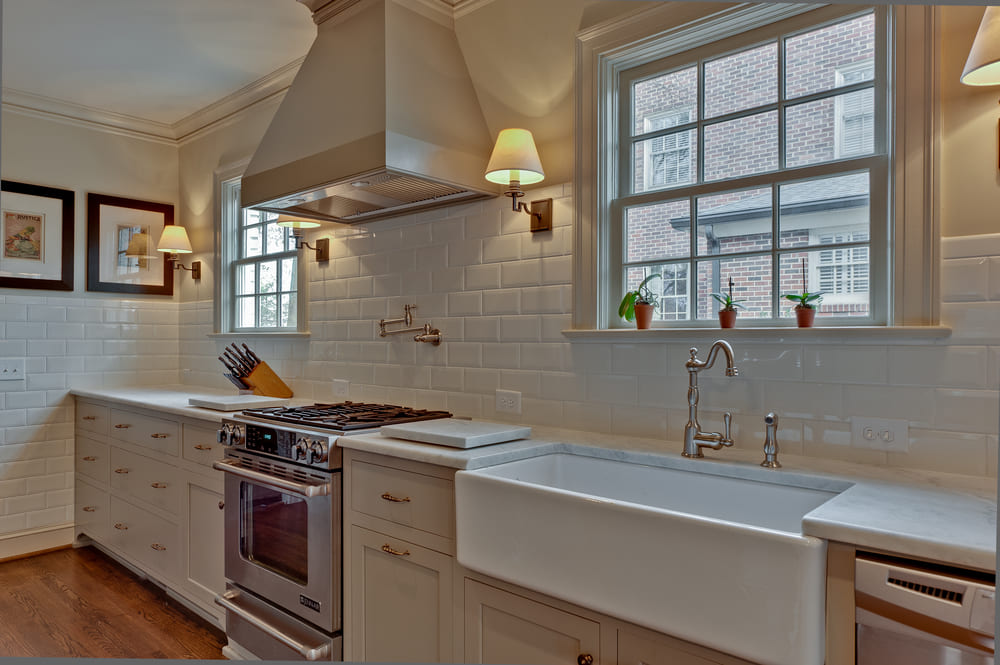 myers park kitchen addition with white farmhouse sink by hopedale builders in charlotte